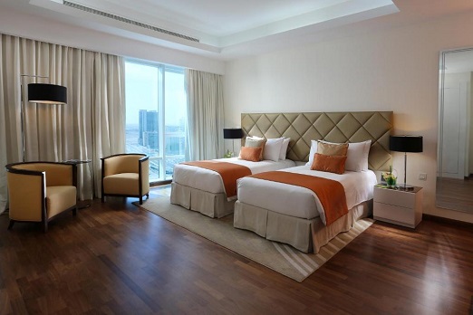 Spacious Bedroom with View at La Suite Hotel Apartments