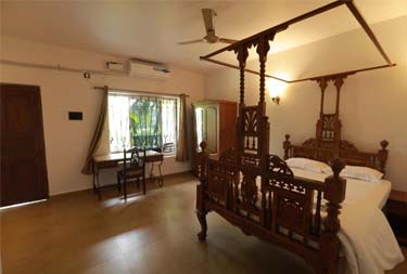 Spacious bedroom at Matildas Service apartments in Goa