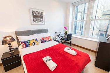 Bedroom with view at Oxford Street Oxford Street Central Apartments in London