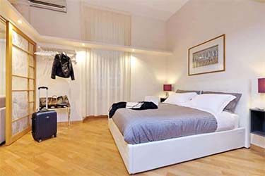 Spacious Bedroom at Veneto Luxury Apartment in Rome