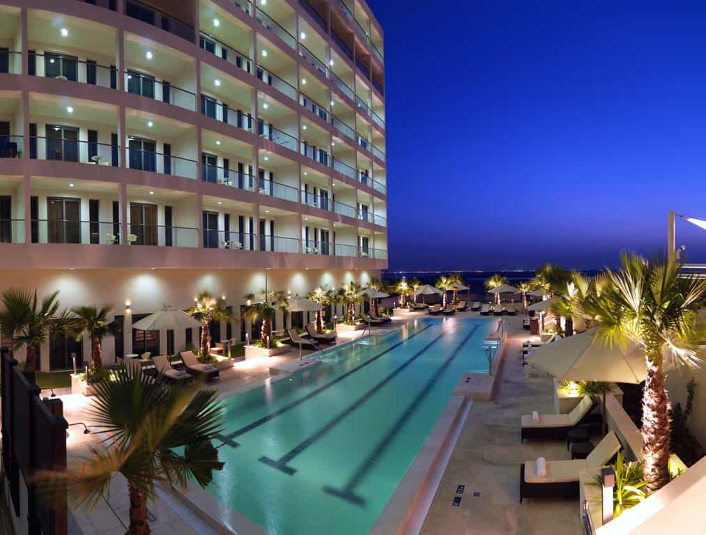 Exterior view with pool at Staybridge Suites Hotel apartments in Yas Island